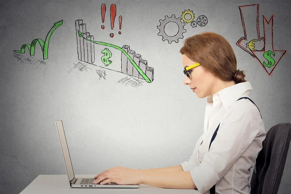 Woman working on computer, anticipation of financial crisis