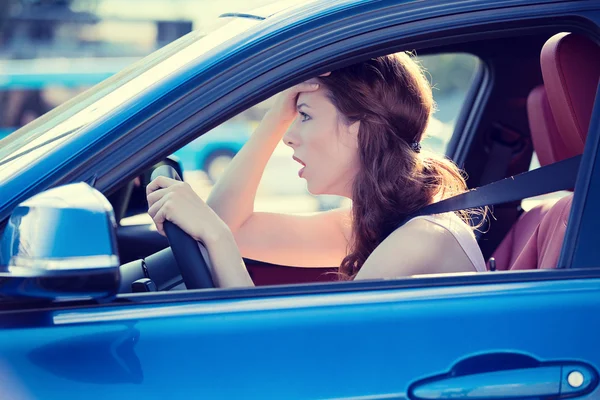 Displeased stressed female car driver