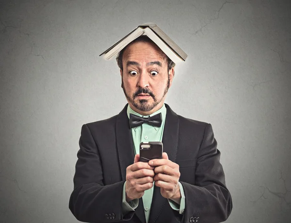 Surprised man reading news on smart phone