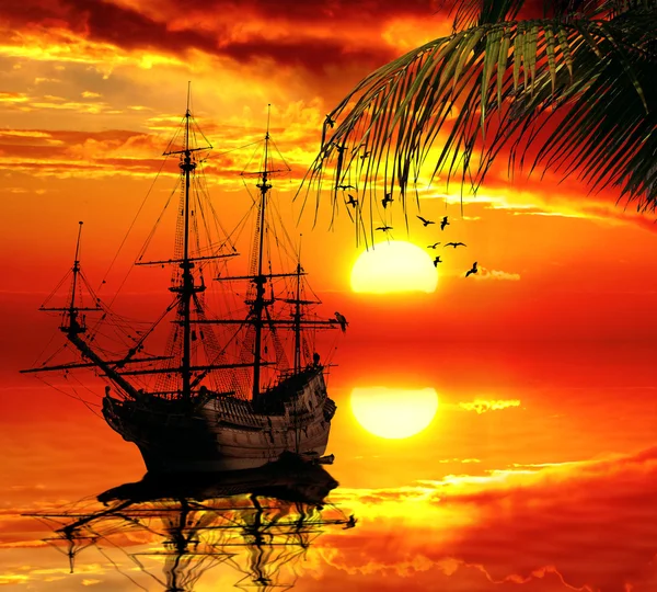 Old sailboat on a sunset skyline