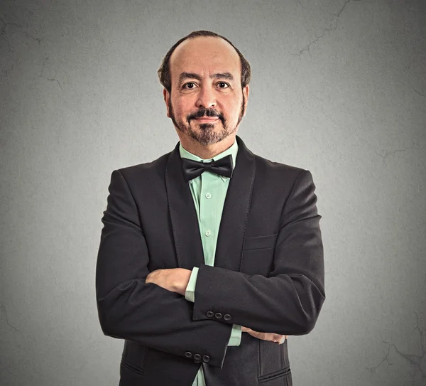 Smiling confident mature balding businessman