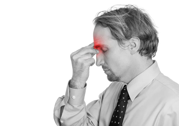 man having suffering from headache hand on head sinus pressure, red area