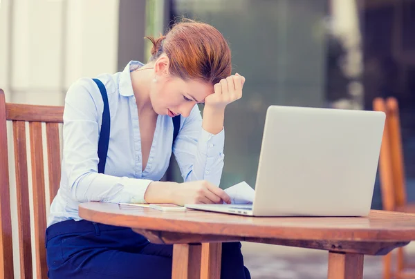 Worried stressed business woman working on computer laptop