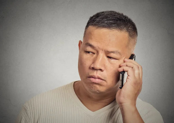 Headshot upset, sad, depressed man worker talking on mobile phone