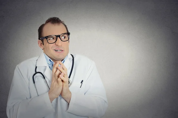 Insecure, crazy male doctor uncertain psychiatrist with glasses