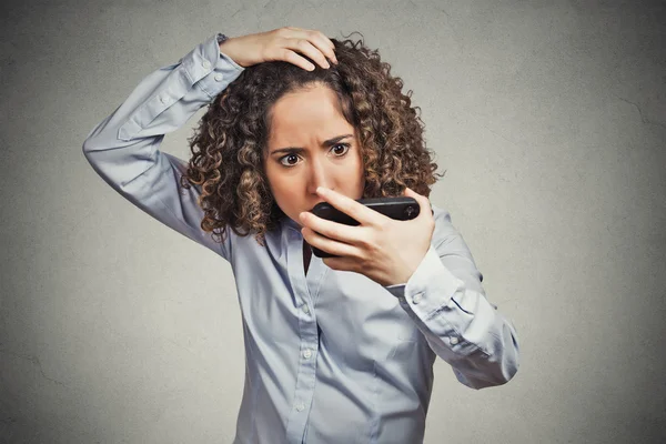 Shocked funny looking young woman, surprised she is losing hair