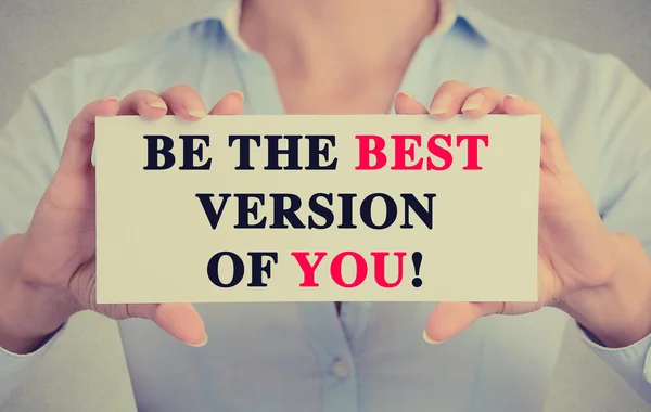 Businesswoman hands card sign with be the best version of you message