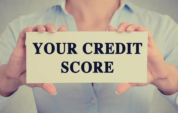 Businesswoman hands holding card sign with credit score text message