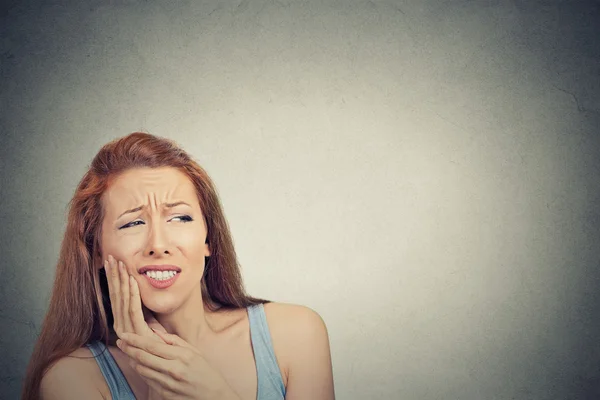 Woman with sensitive tooth ache crown problem