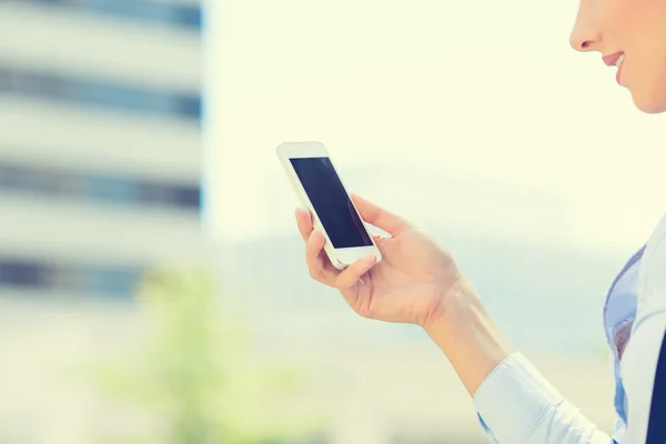 Closeup woman hand holding smart mobile phone