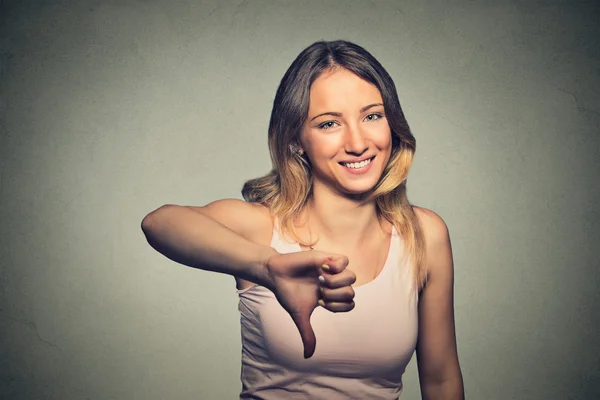 Sarcastic woman showing thumbs down happy someone made mistake failed