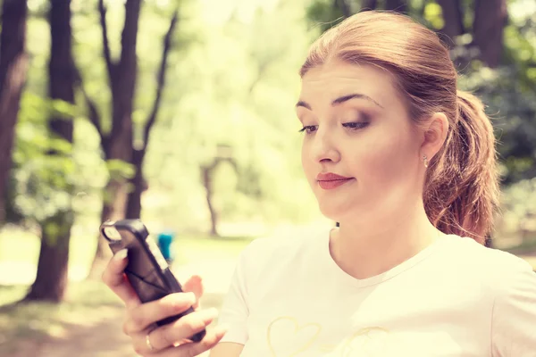 Upset skeptical unhappy serious woman talking texting on phone