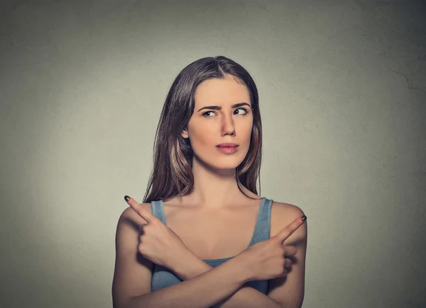 Woman pointing in two different directions not sure which way to go in life