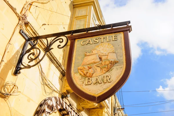 Alley with typical bar signs, in Victoria, Gozo