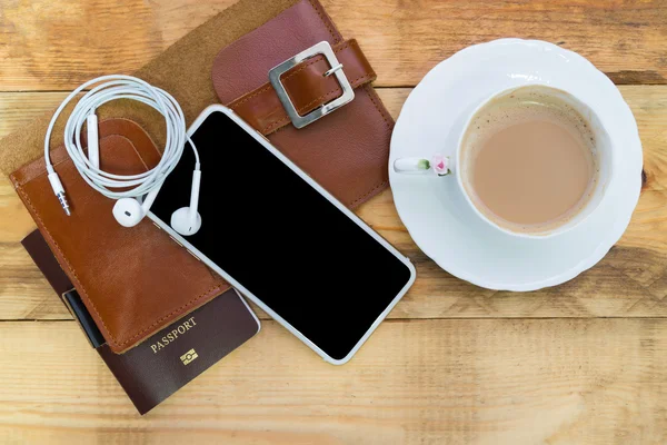 Preparation for travel, Top view of smartphone, coffee with milk