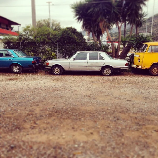 Old cars parked in yard