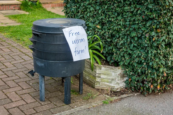 Free worm farm offered on a street for collection