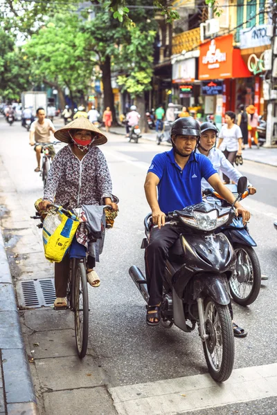 HANOI, VIETNAM, JUNE 15, 2015: People waiting at the traffic lig