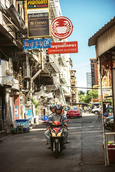 BANGKOK, THAILAND - 10 JUNE, 2015: Traffic in a small street wit