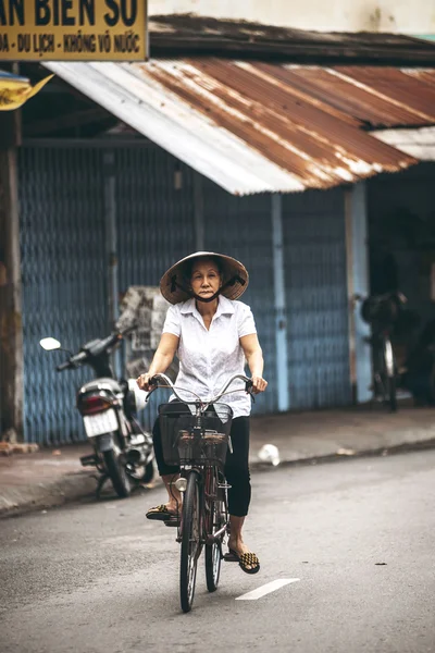 MEKONG DELTA - JUNE 14: An unidentified middle aged woman riding