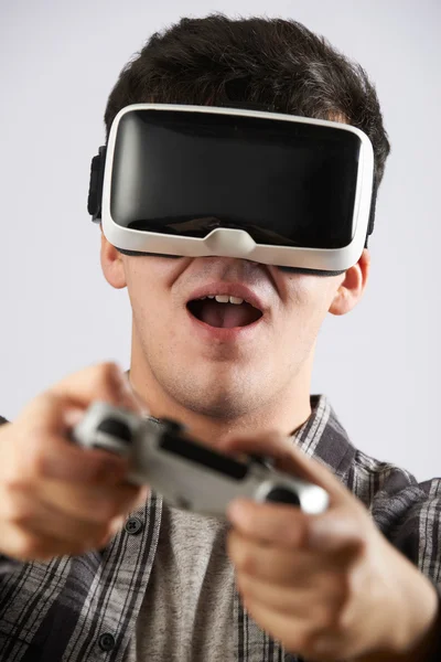 Man Playing Video Game Wearing Virtual Reality Headset
