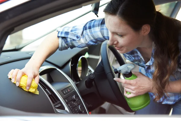 Woman Cleaning Interior Of Car