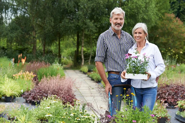 Portrait Of Mature Couple Shopping At Garden Center