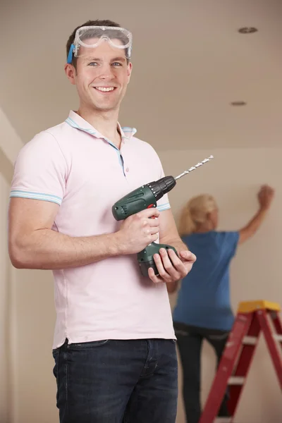 Young Couple Carrying Out Home Improvements