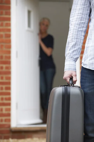 Man With Packed Suitcase Leaving Wife