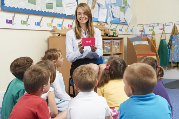 Teaching Showing Flash Cards To Elementary School Class