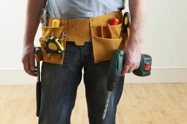 Workman Wearing Toolbelt With Tools