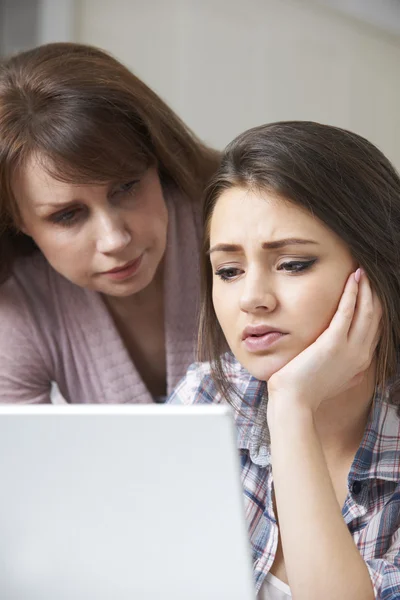 Mother Comforting Daughter Being Bullied Online