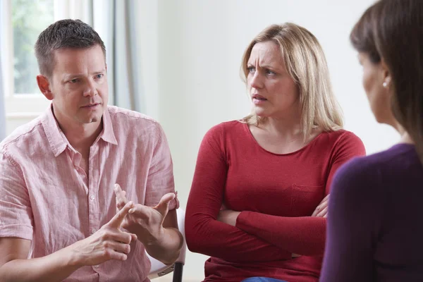 Couple Arguing In Front Of Relationship Counsellor