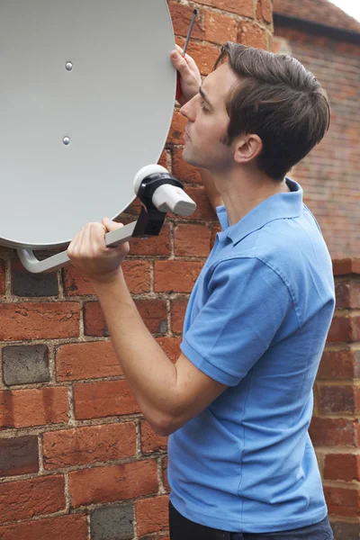 Engineer Installing TV Satellite Dish