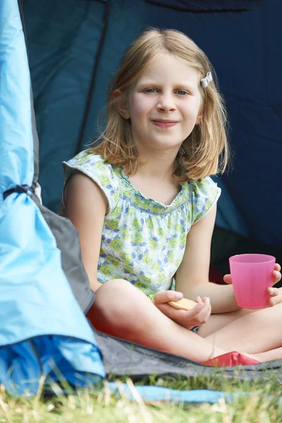 Girl Having Snack On Camping Trip