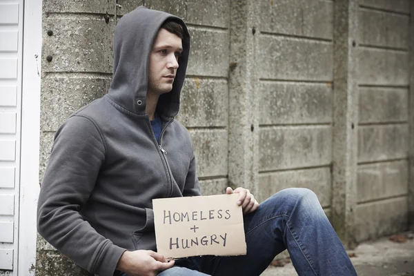 Homeless Young Man Begging On The Street
