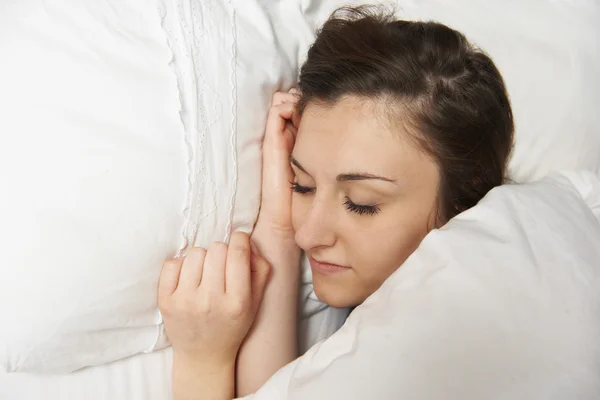 Teenage Girl Sleeping Peacefully In Bed