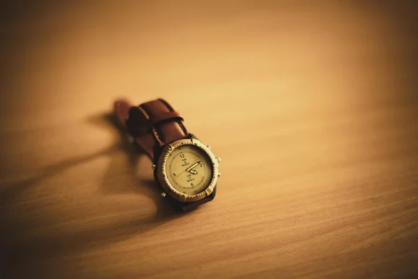 Wrist watch on wooden background