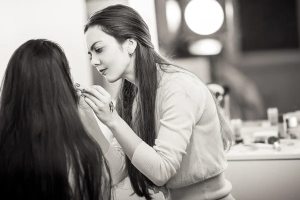 Makeup artist apply makeup