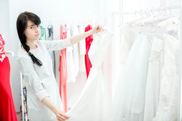 bride selects the wedding dress