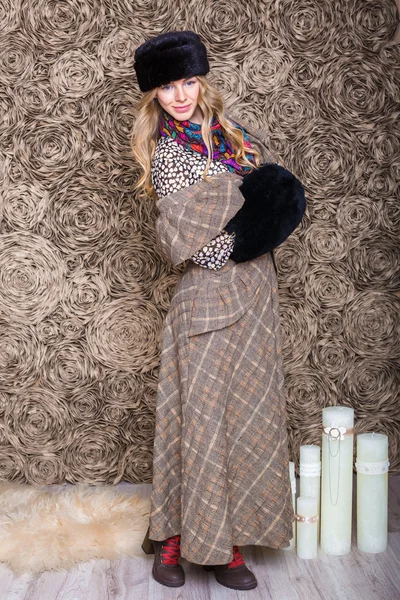 Girl in a brown dress and black fur hat