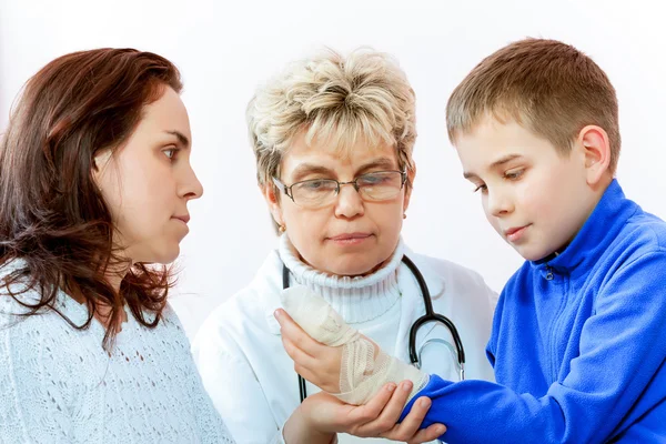 Doctor examining a child in a hospital