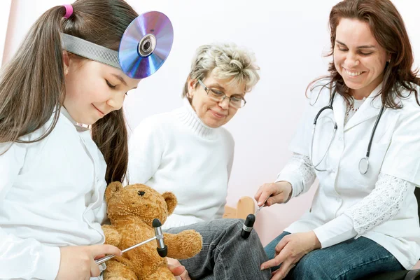 Doctor examining a child in a hospital