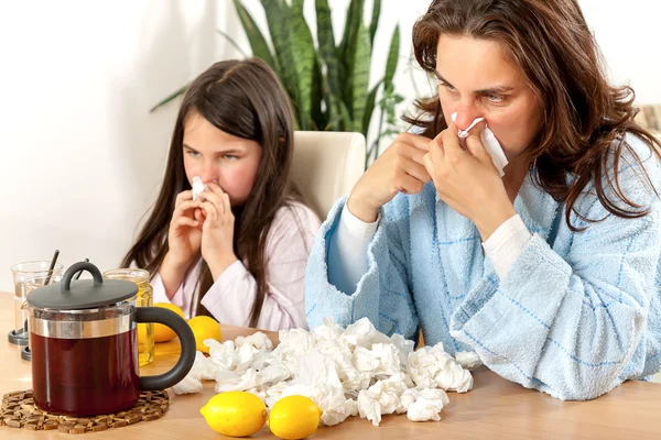 Mother and daughter with cold or flu