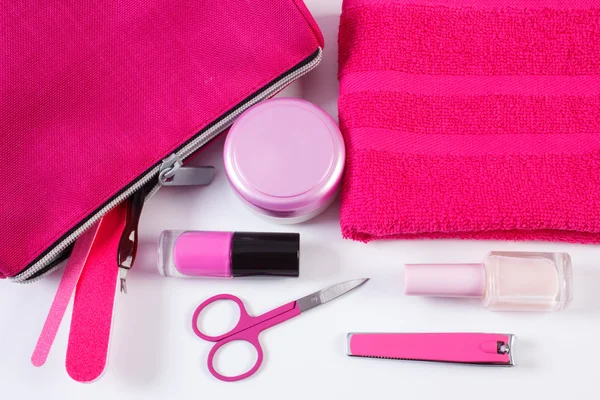Cosmetics and accessories for manicure or pedicure with pink bag cosmetic, concept of nail care