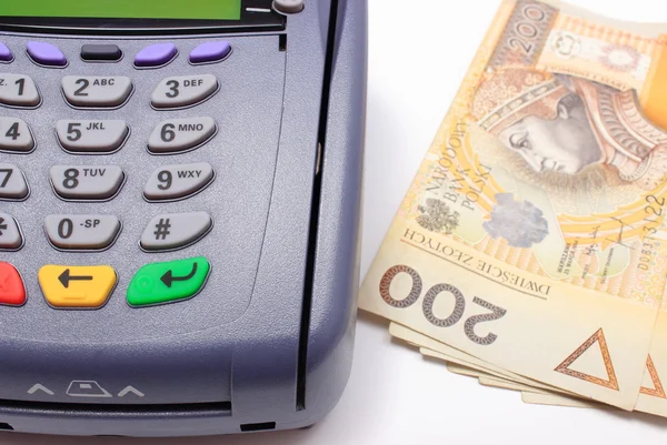 Payment terminal with money on white background