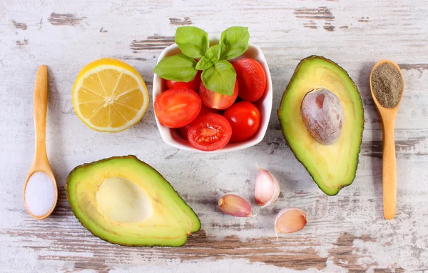 Avocado with ingredients and spices to avocado paste or guacamole, healthy food and nutrition