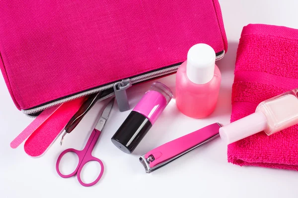 Cosmetics and accessories for manicure or pedicure with pink bag cosmetic, concept of nail care