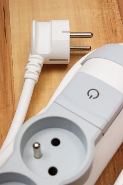 Electrical power strip with switch on-off on wooden floor