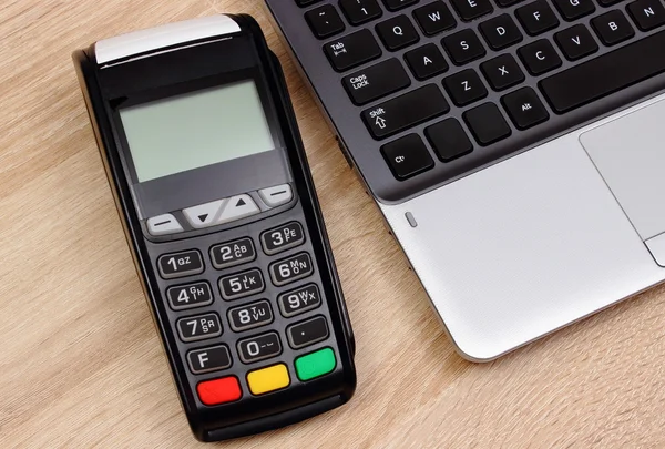 Credit card reader for paying and laptop, finance concept